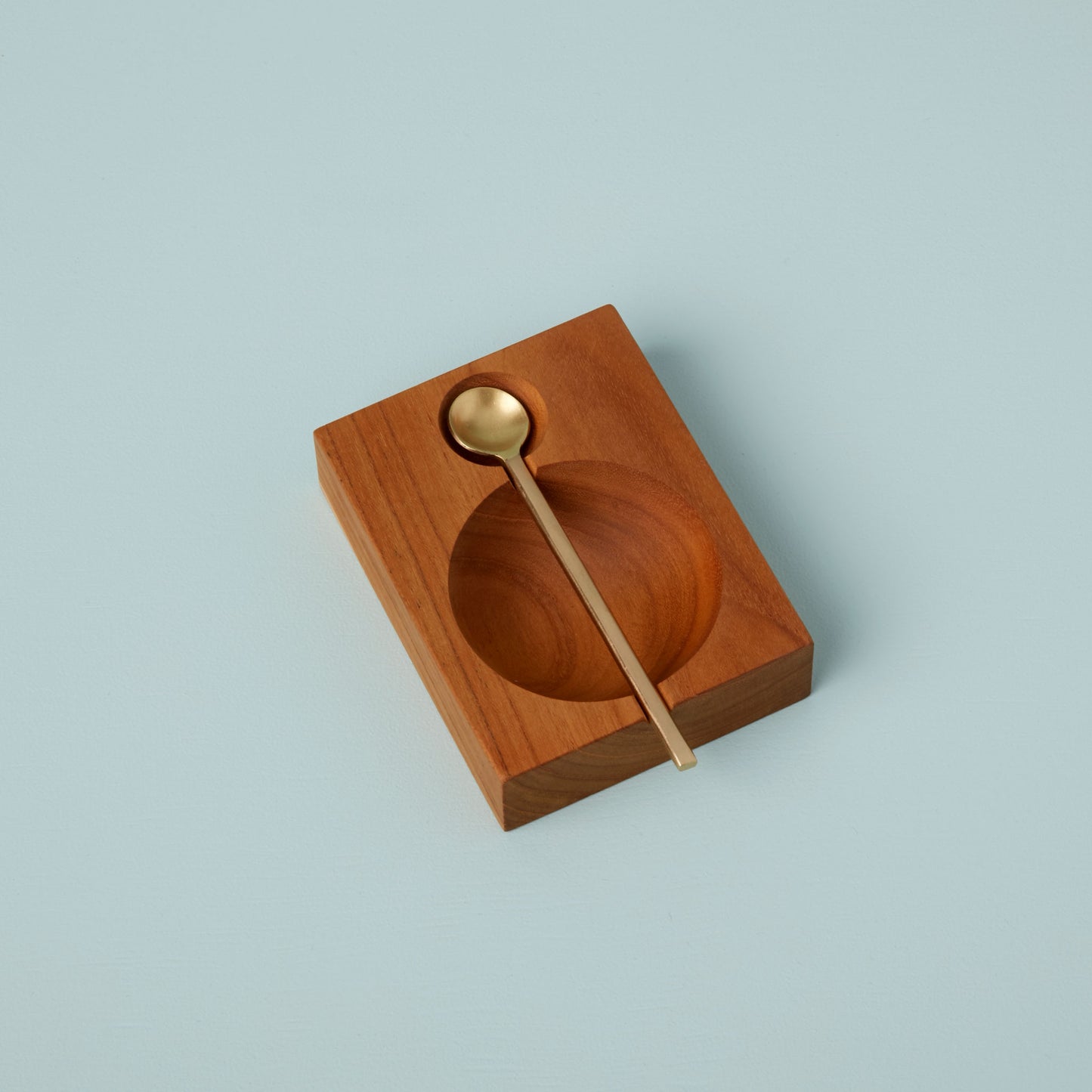 Teak Cellar with Gold Spoon
